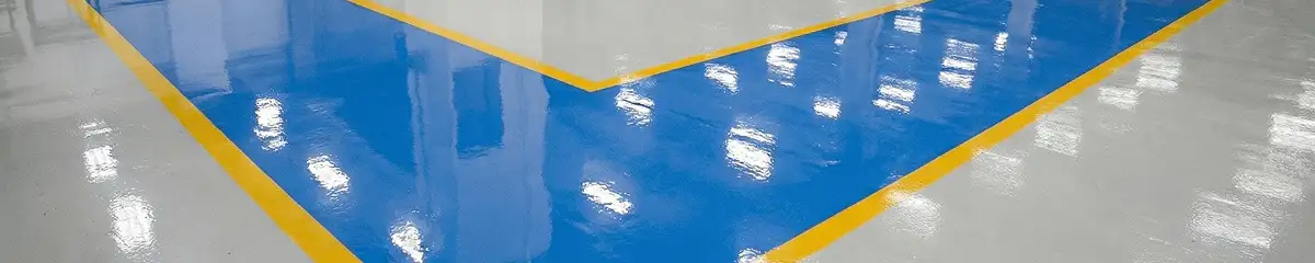 A factory floor professionally covered and marked with epoxy flooring in Oakland, CA