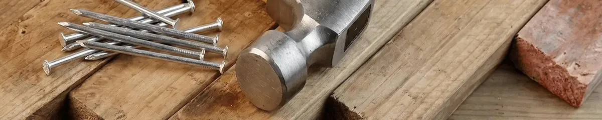 Hammer and nails on hardwood flooring boards in Oakland, CA