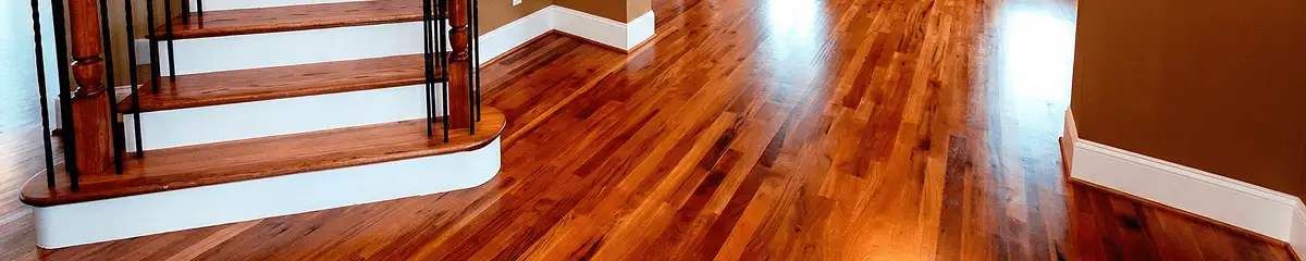 Base floor of a staircase with professionally restored wood flooring in Oakland CA