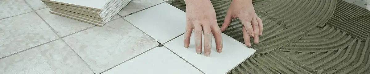 Professional installing white tile floors in Oakland, CA