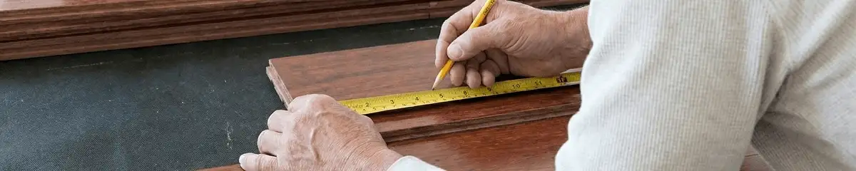 A professional installing wood flooring in Oakland, CA
